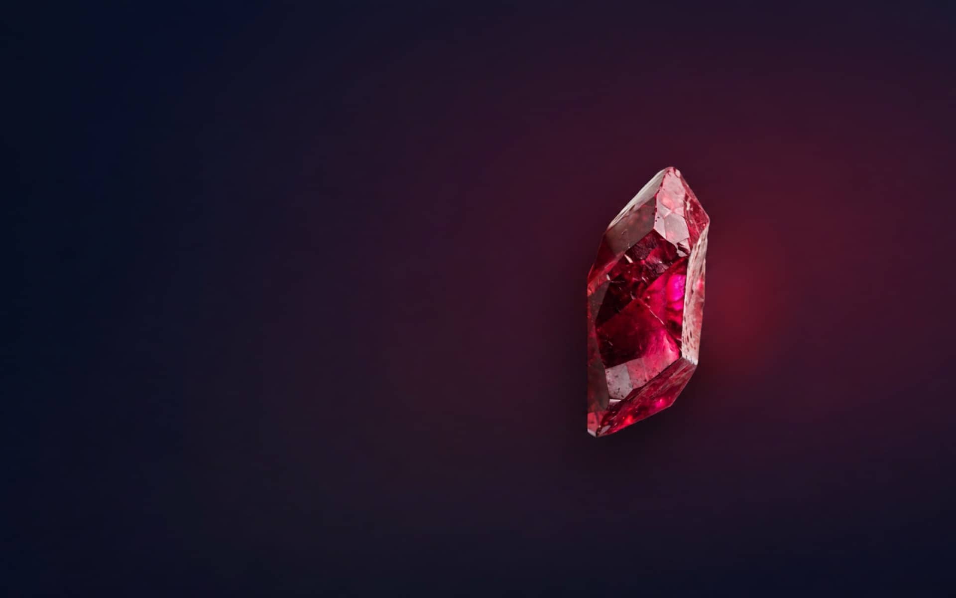 Natural faceted gemstone on a dark field